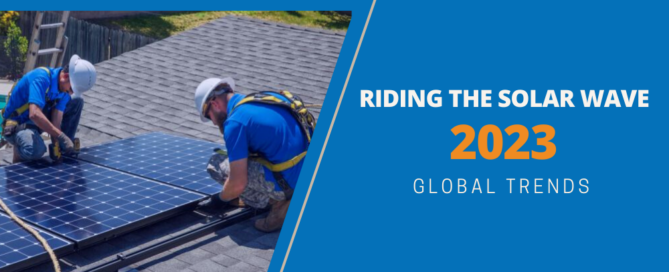 Riding the solar wave 2023 global trends. Two workers installing solar panels on top of roof.