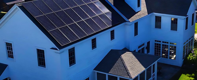 Residential solar panel installation by Sea Bright Solar on a white house