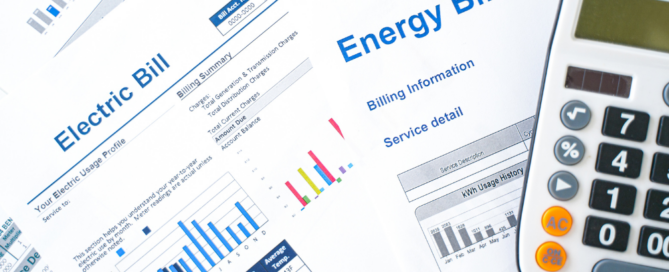 Electric and energy bills with a calculator, representing utility expenses and energy cost management.