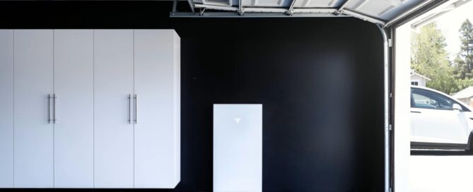 Tesla Powerwall 3 home battery installed in a residential garage, highlighting whole-home backup power and energy storage solutions for 2026.